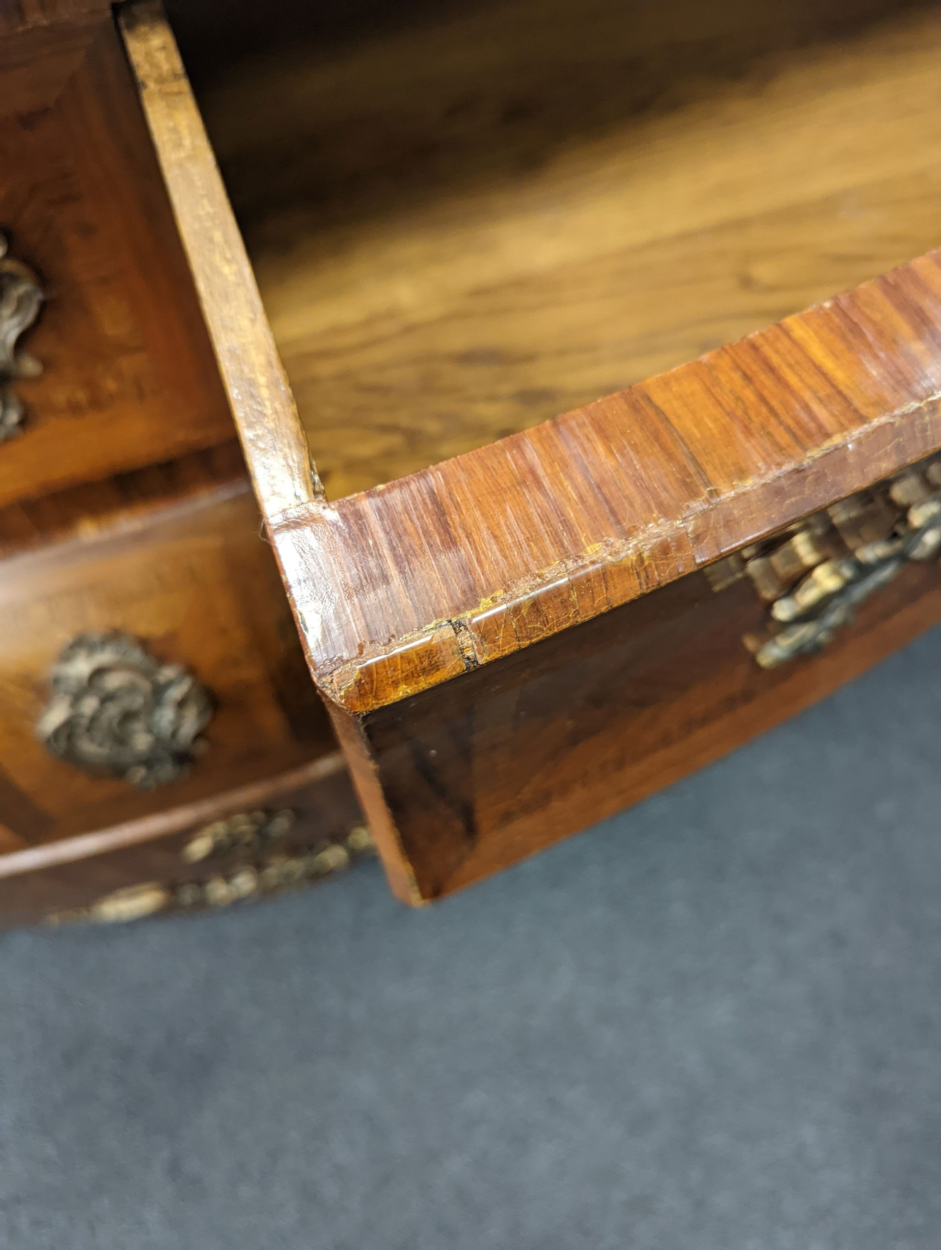 A Louis XV style marble topped serpentine bombe commode - impressed maker's stamp, M.P., width 140cm, depth 59cm, height 90cm